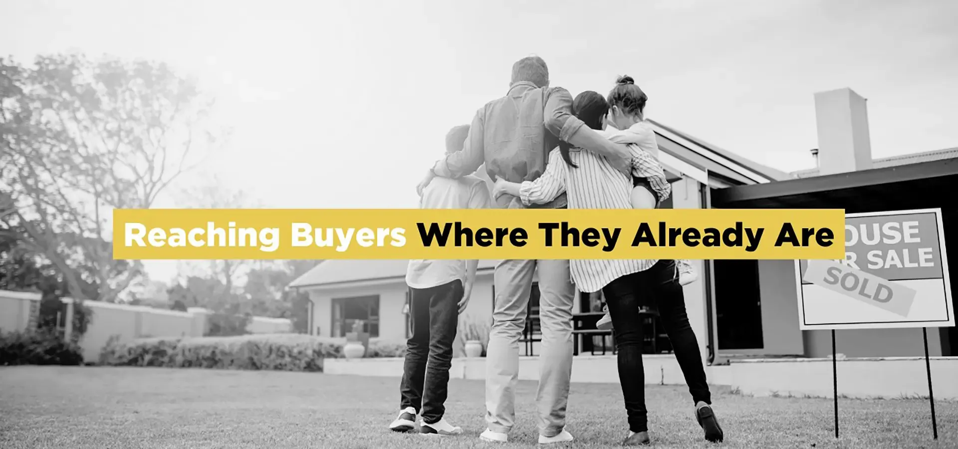 Family standing outside a newly sold home, representing digital marketing for modern homebuyers.