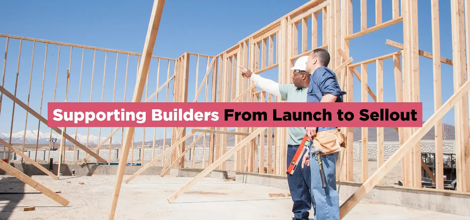 Construction professionals reviewing framing progress at a new residential home development site.