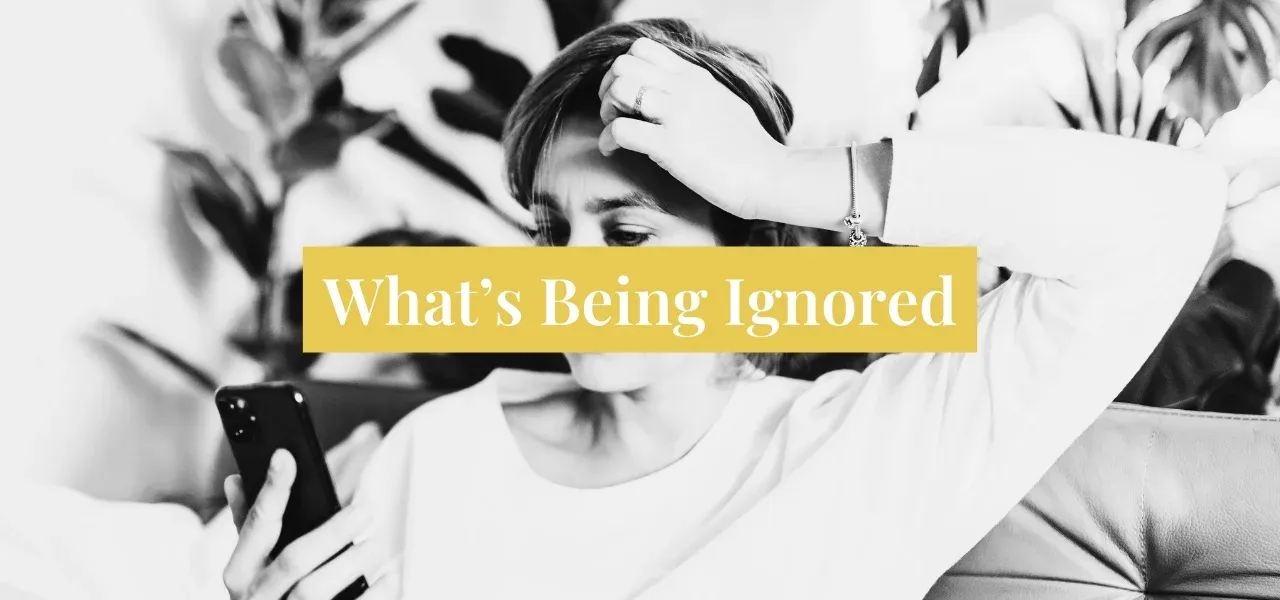 Frustrated person looking at a smartphone while scrolling through social media, illustrating content that fails to capture attention.